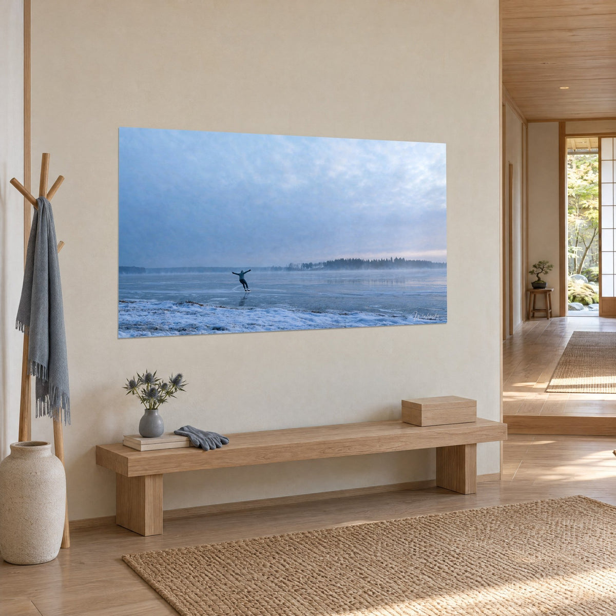Wall art silhouette gliding over grey ice, dark pine forest and lavender cloudy sky, three-quarter view in a Japandi hallway