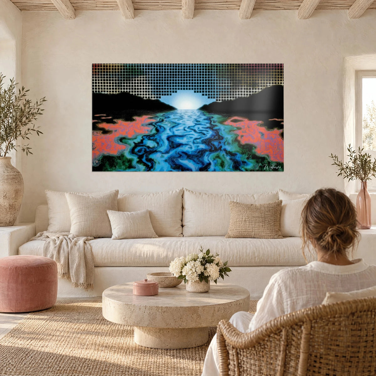 Wall art winding turquoise river beneath an op art grid, coral orange banks, person seen from behind, above a sofa in a bright living room