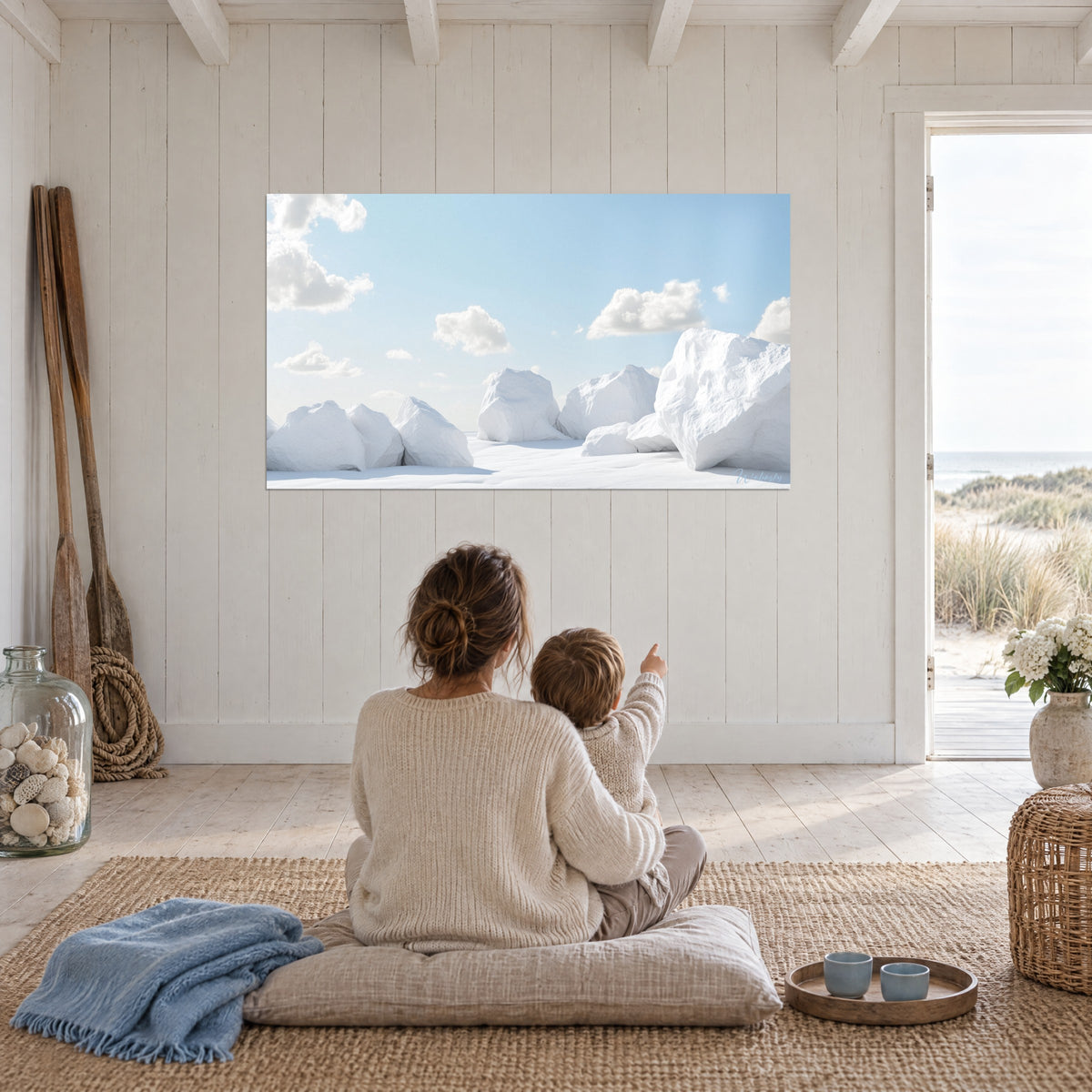 Quadro di distesa innevata con monoliti bianchi, cielo azzurro pallido, di fronte a una madre e a suo figlio seduti per terra