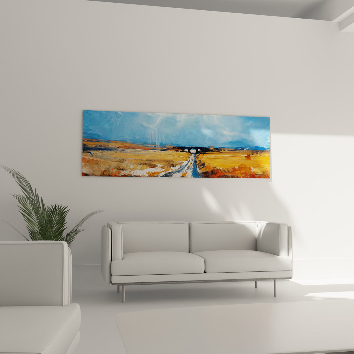 Campagne peinte en tons ocre et bleu, disposée au-dessus d'un canapé dans un salon lumineux