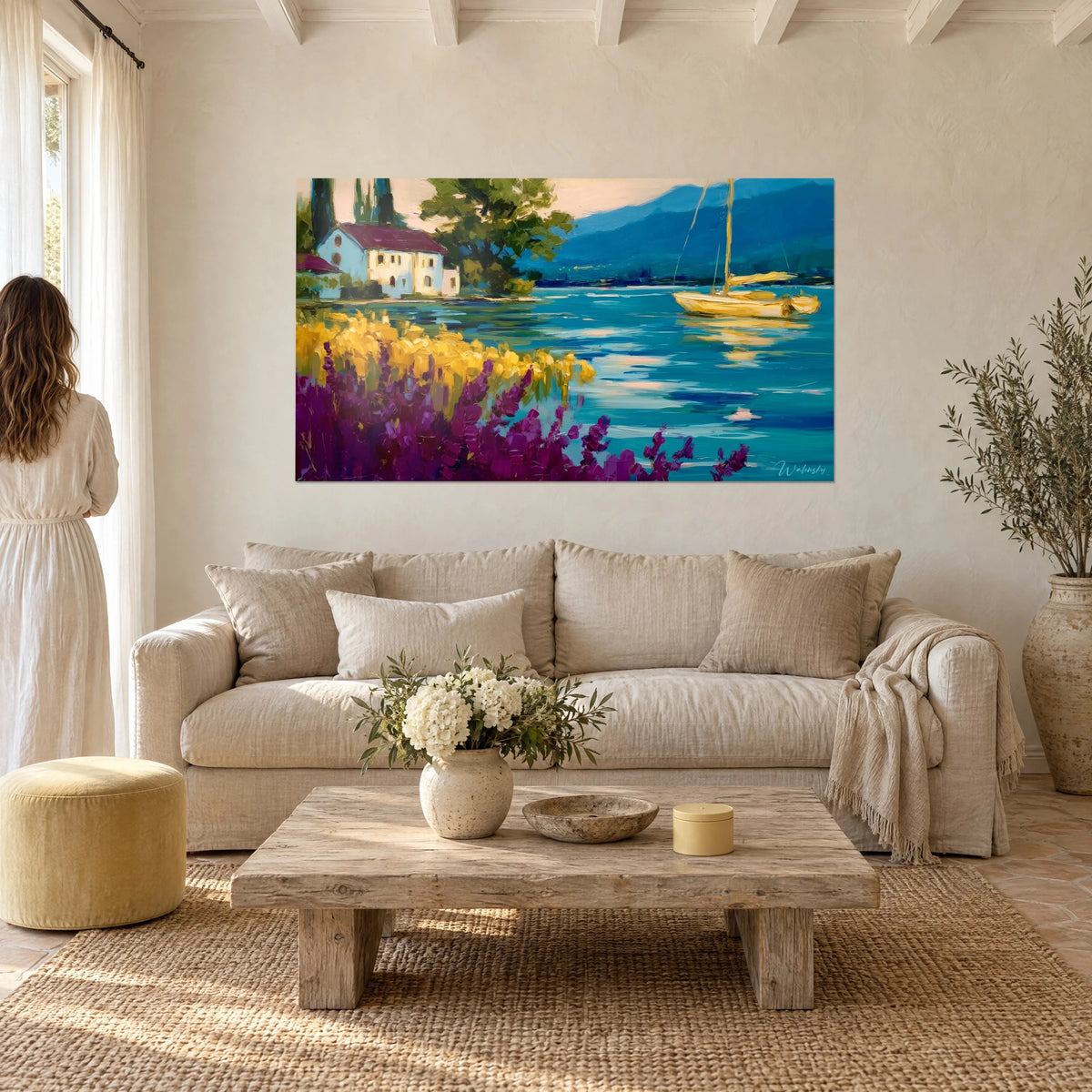 Wall art Yellow sailboat anchored on a turquoise lake, violet lavender in the foreground, above a sofa in a bright living room