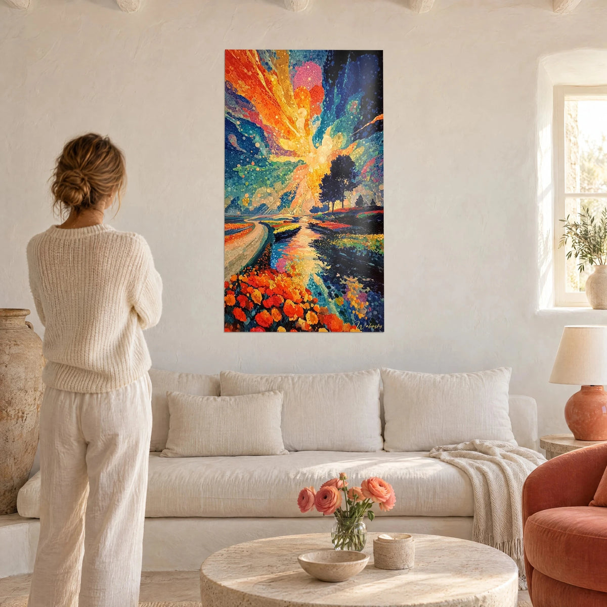 Wall art sunset landscape in pointillism, orange sky and midnight blue, field of red tulips, above a sofa in a bright living room