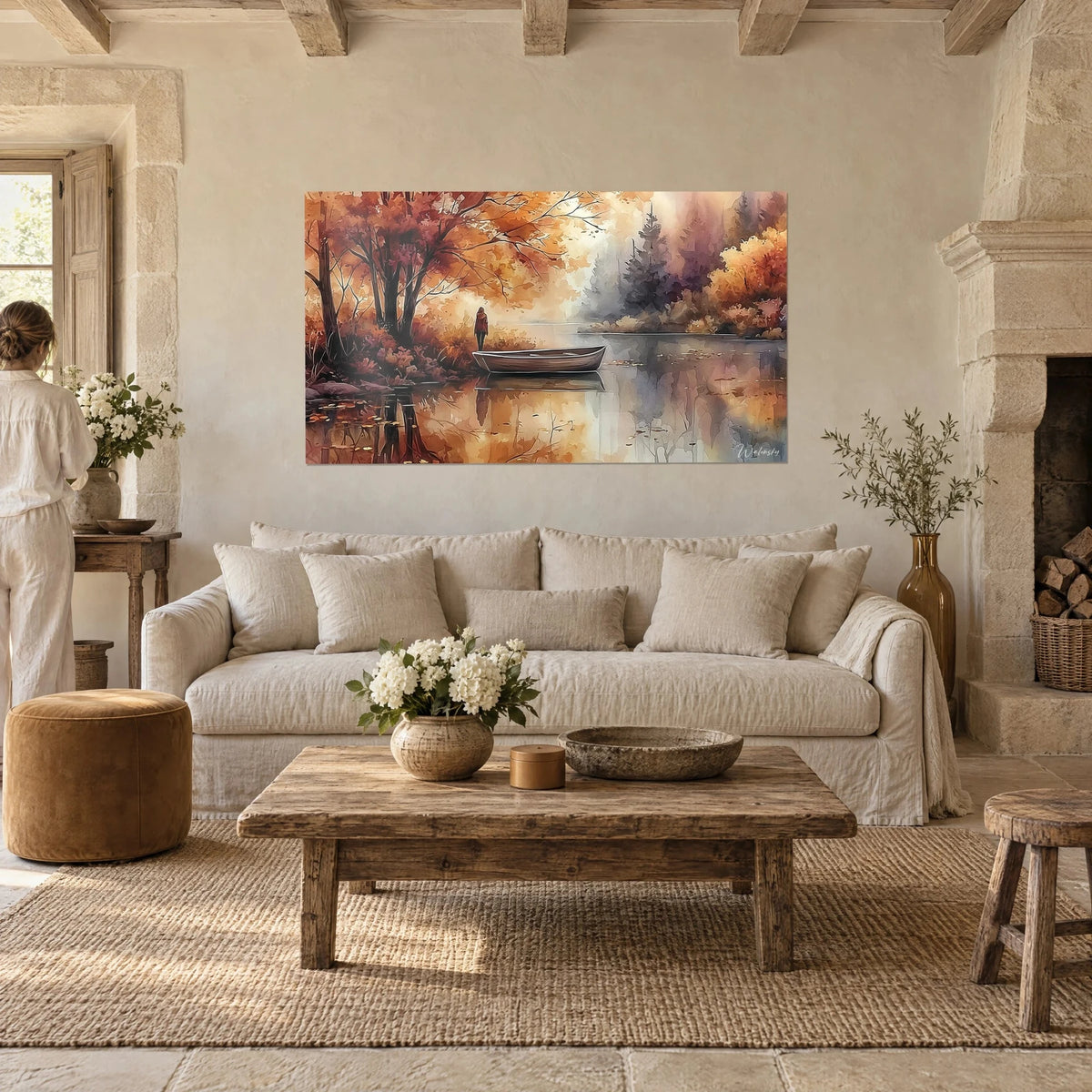 Wall art moored boat beneath russet and rust-colored maples, amber reflections on the water, hung above a sofa in a bright living room