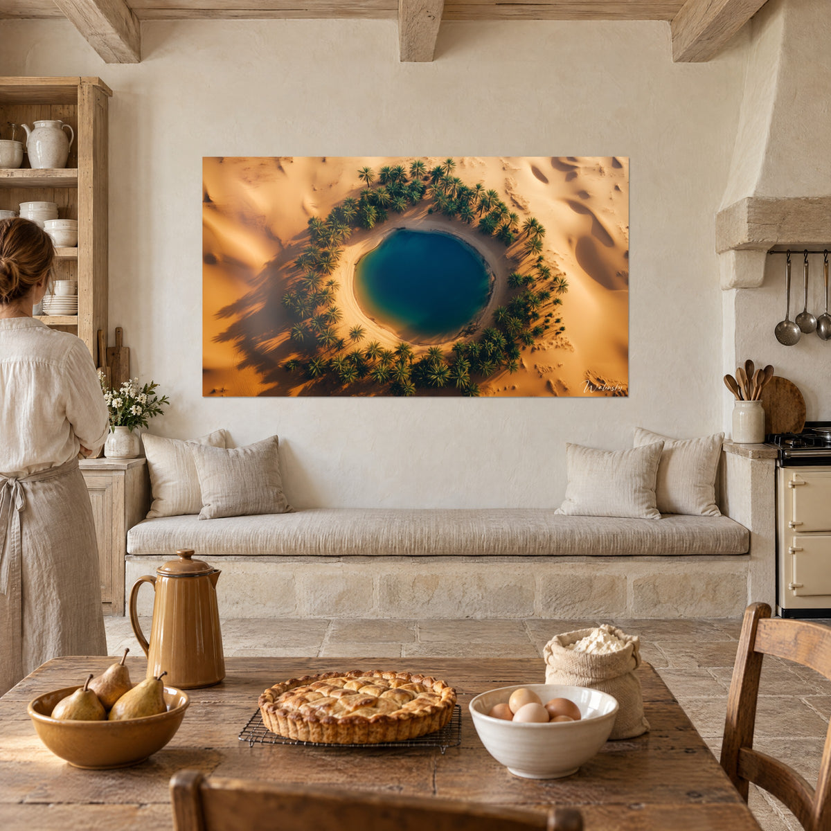 Wall art midnight-blue Saharan basin encircled by green palm fronds and amber sand, beside a stone kitchen and a pear tart