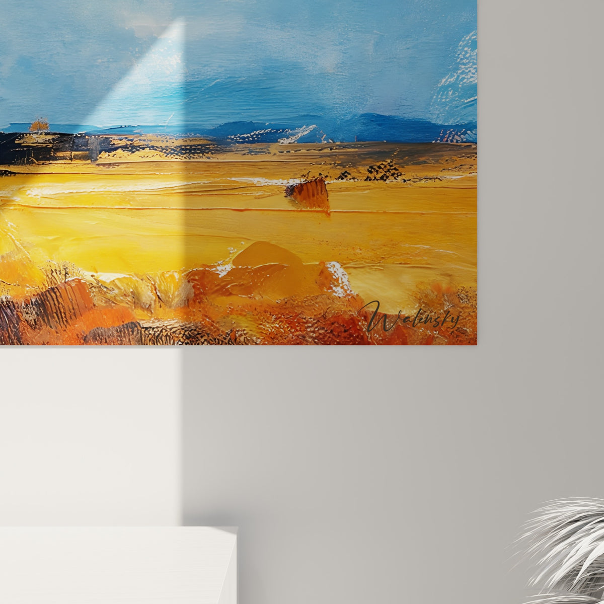 Empâtements ocre et coulures bleues visibles de près sur la toile du paysage accroché