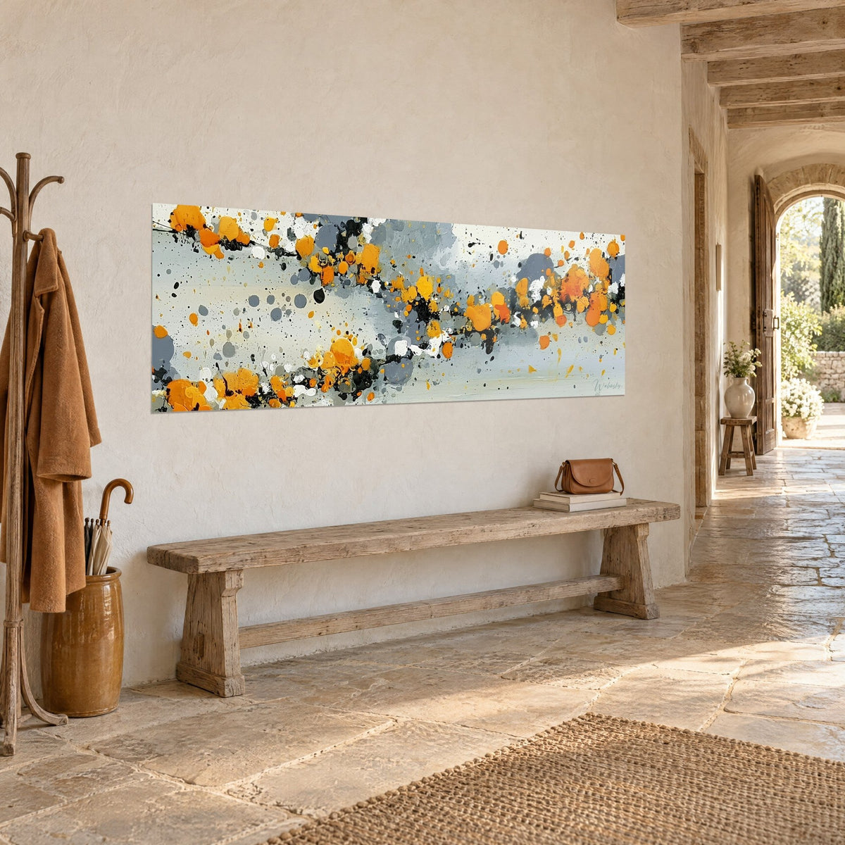 Wall art with saffron droplets and grey-blue marks in a panoramic strip, pale stone, wooden bench and coat hooks, country house entrance