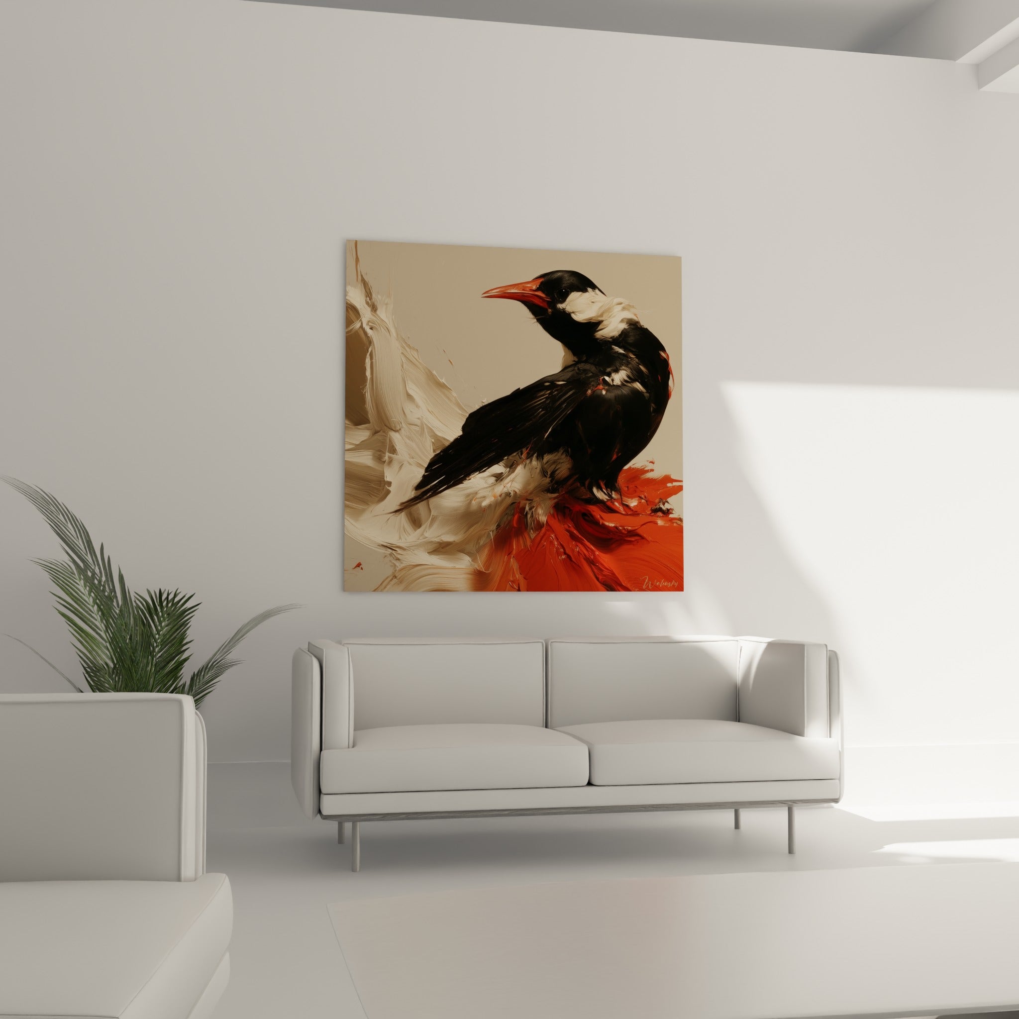 Oiseau noir texturé aux touches blanches et rouges, tableau placé au-dessus d'un canapé dans un salon lumineux