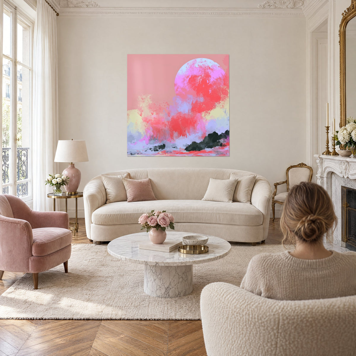 Wall art pink and lilac sphere streaked with coral red, black rocks and pastel foam, above a sofa in a bright living room