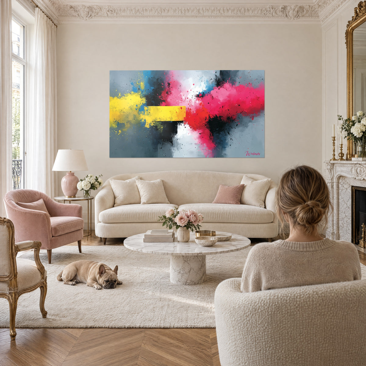 Wall art powder explosion in yellow and pink on grey background, central yellow band, above a sofa in a bright living room