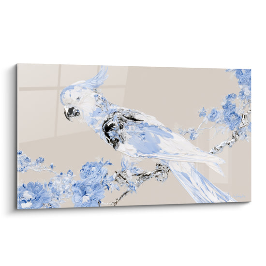 Cacatoès blanc et bleu pastel perché sur une branche fleurie argentée