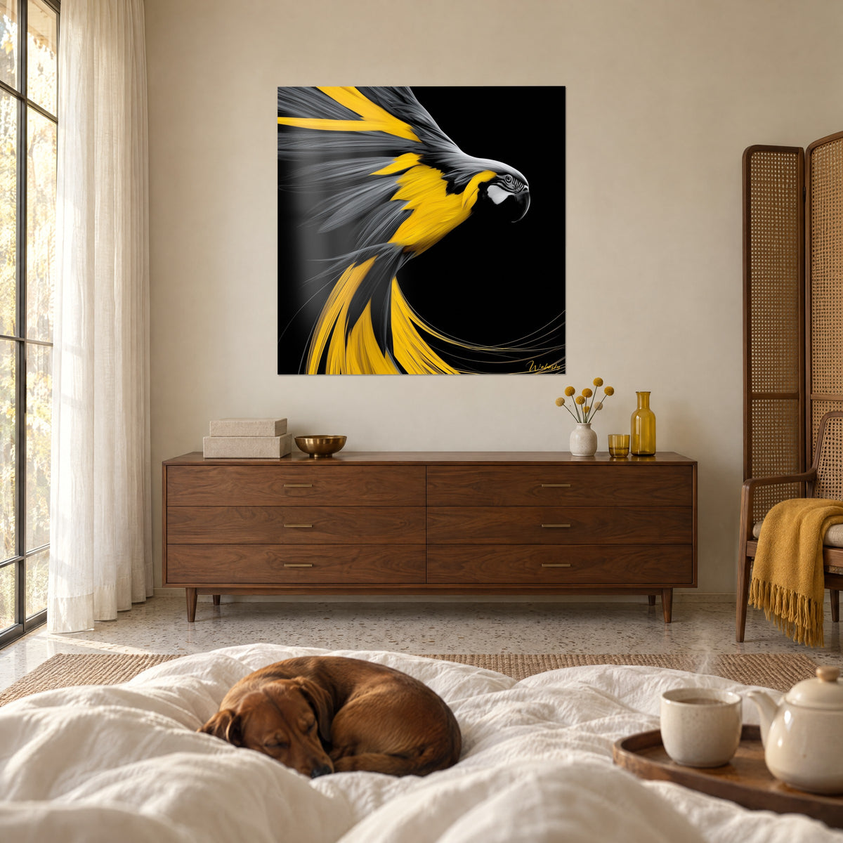 Wall art of a golden parrot in full flight, grey-striped feathers on a deep black background, with a sleeping dachshund, above a bed in a light bedroom