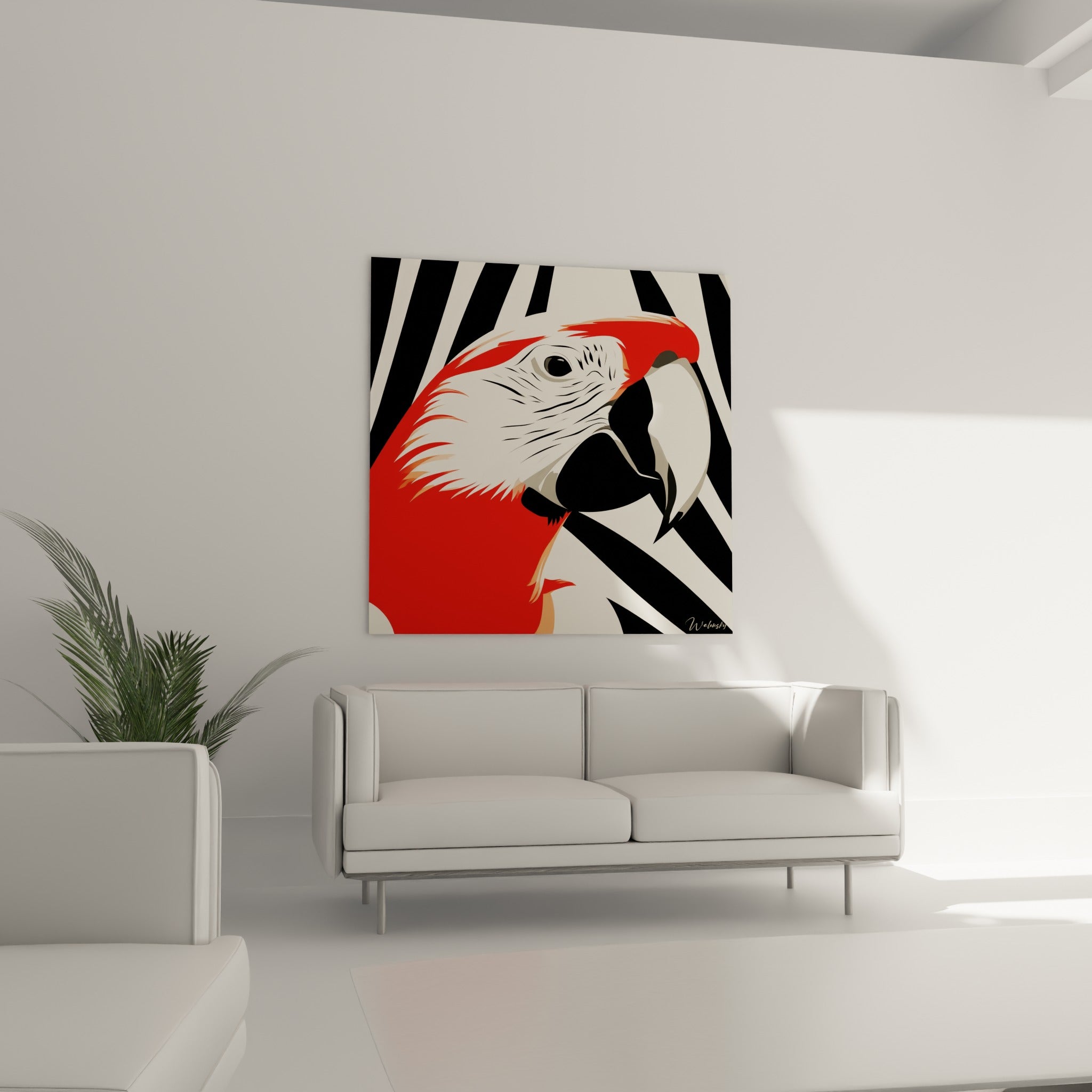 Ara graphique rouge et noir positionné au-dessus d'un canapé dans un salon lumineux