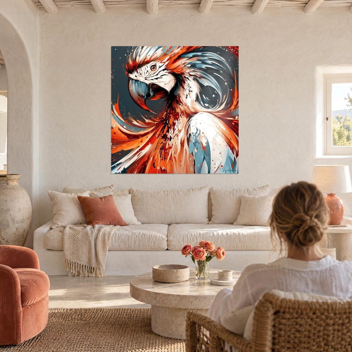 Wall art orange and steel blue splattered parrot macaw feathers, amber eye, above a sofa in a bright living room