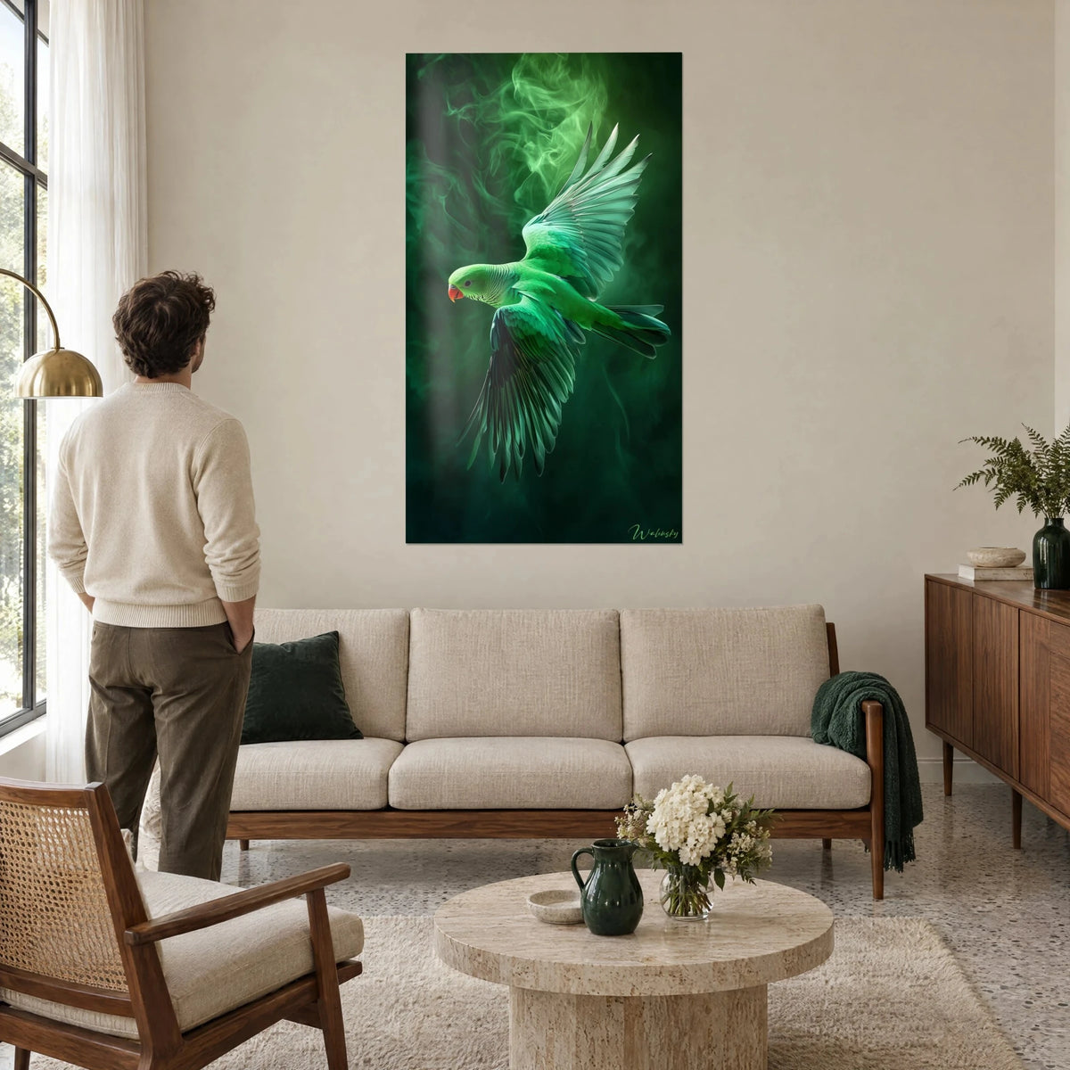 Wall art green budgerigar in full flight, wings spread over emerald smoke, coral beak, a man seen from behind, above a sofa in a bright living room
