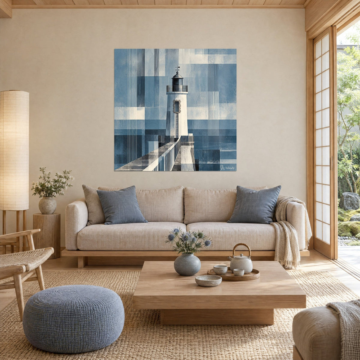 Wall art white lighthouse with a dark lantern against a geometric navy blue background, grey breakwater, above a sofa in a bright living room