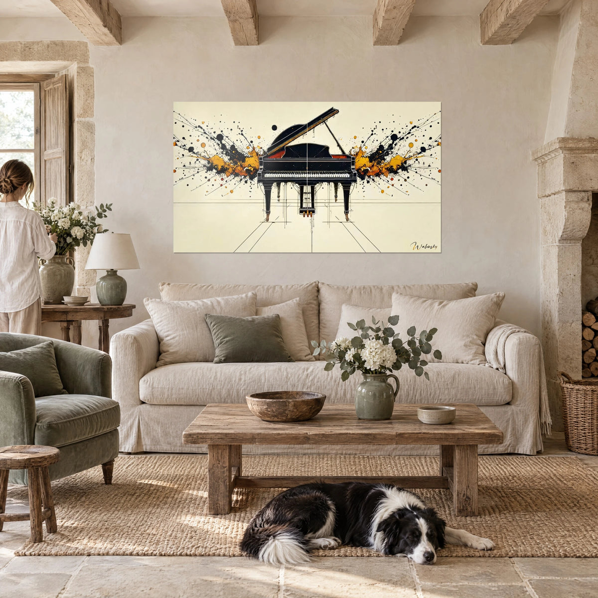 Cuadro piano de cola negro rodeado de salpicaduras ocre y negras sobre fondo crema, collie tumbado, encima de un sofá en un salón luminoso