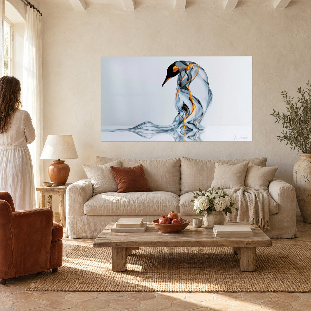Wall art translucent penguin in grey smoke swirls streaked with orange, beak tilted, above a sofa in a bright living room