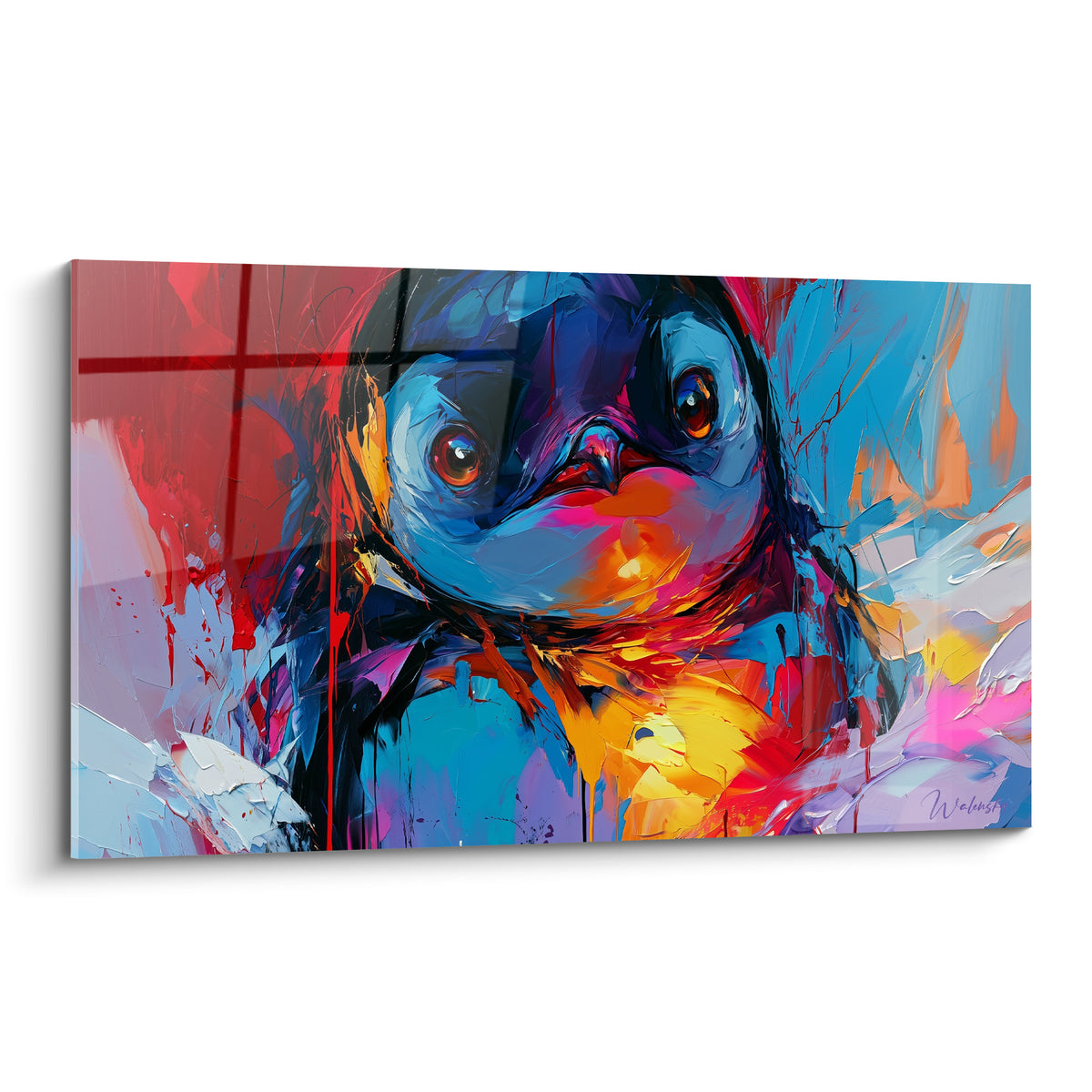 Pingouin en gros plan aux yeux orangés, plumage bleu marine et rouge vif éclatant