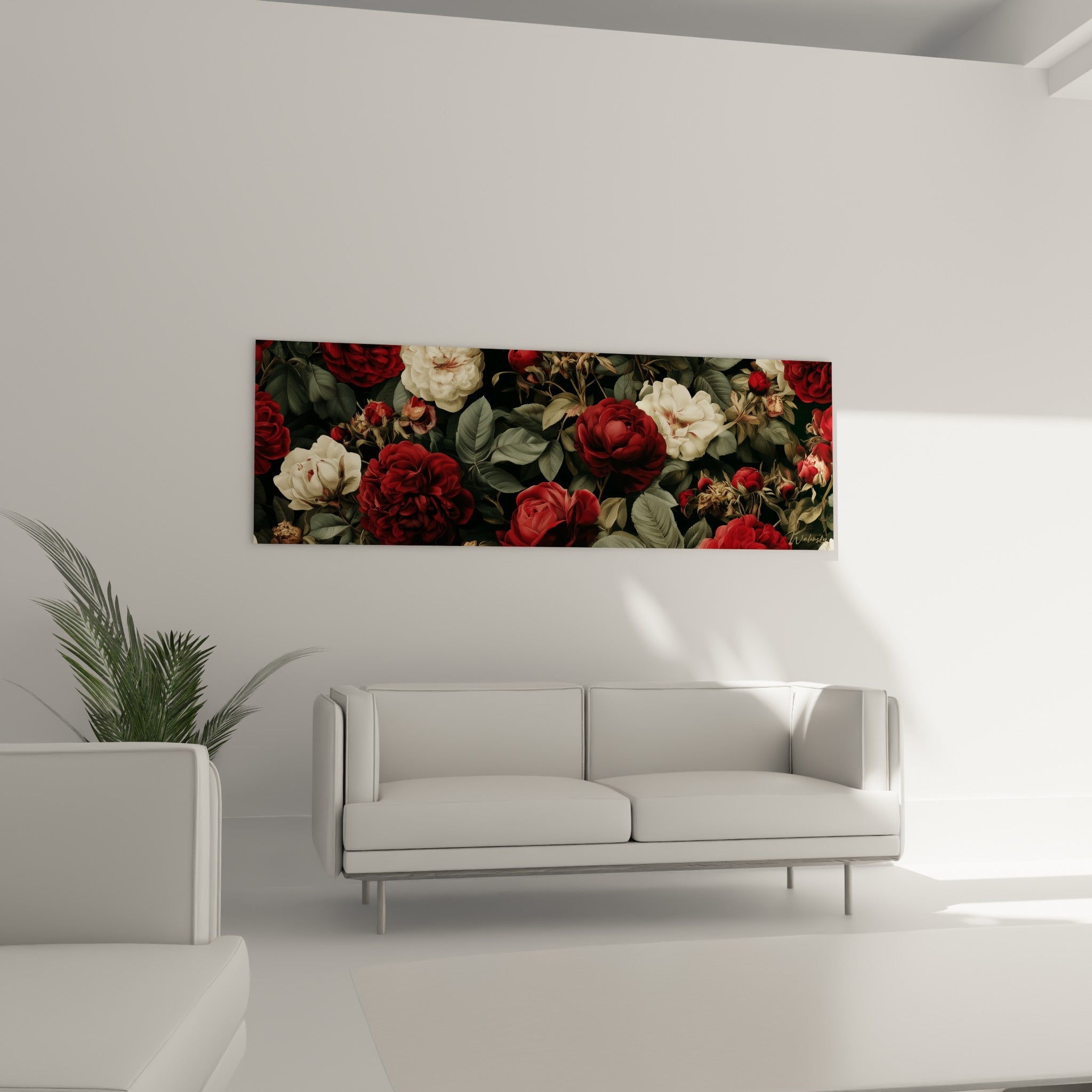 Roses rouge profond et blanc crème entourées de feuillage sauge au-dessus d'un canapé dans un salon lumineux