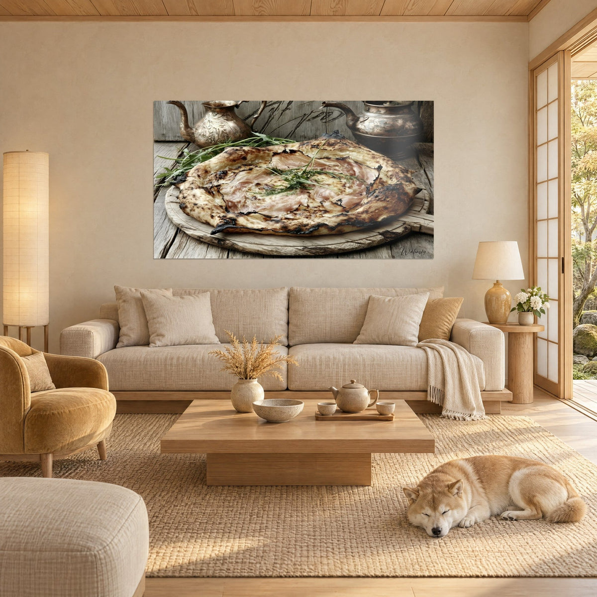 Wall art of a golden galette with prosciutto and arugula on a wooden board, antique copper, sleeping Shiba, above a sofa in a bright living room