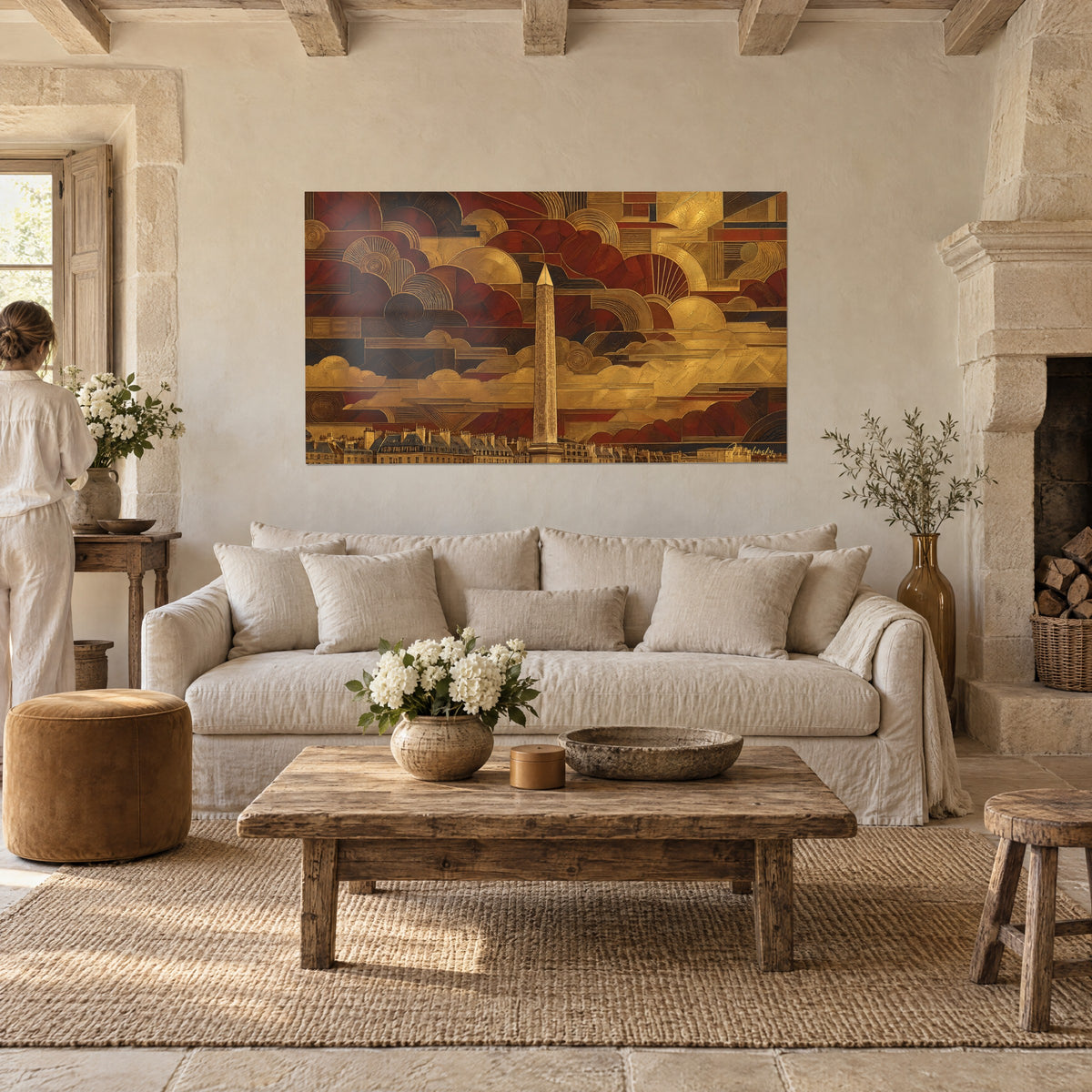 Wall art golden obelisk on stylized burgundy sky, ochre cloud arches, viewed from behind above a sofa in a bright living room