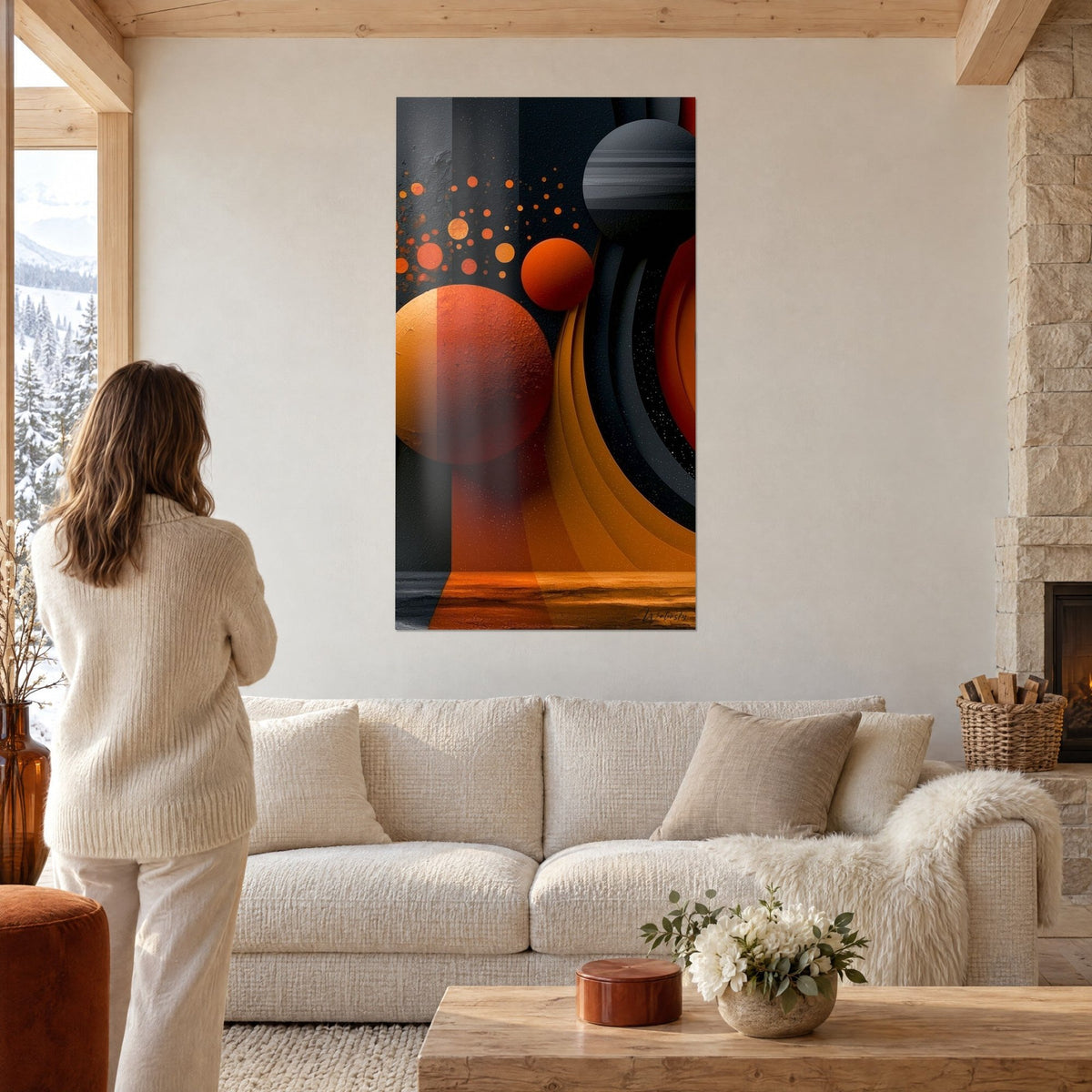 Wall art with orange and charcoal planets in orbit, undulating golden rings, above a sofa in a bright living room