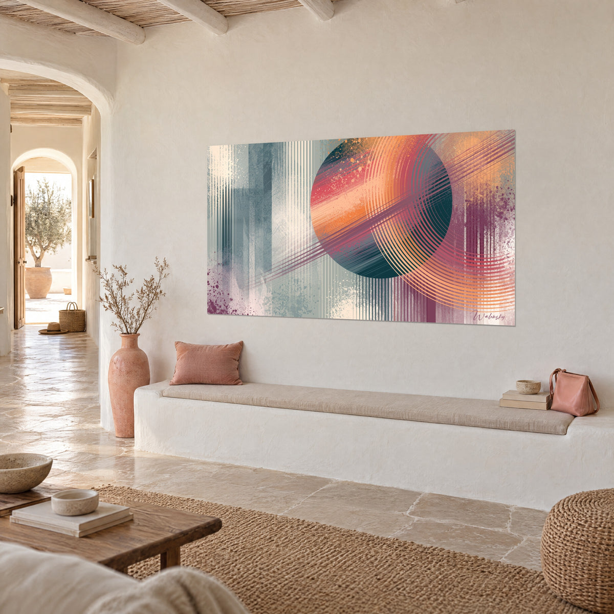 Wall art coral and petrol blue planet crossed by ivory lines, hung on the wall of a Mediterranean house in three-quarter view
