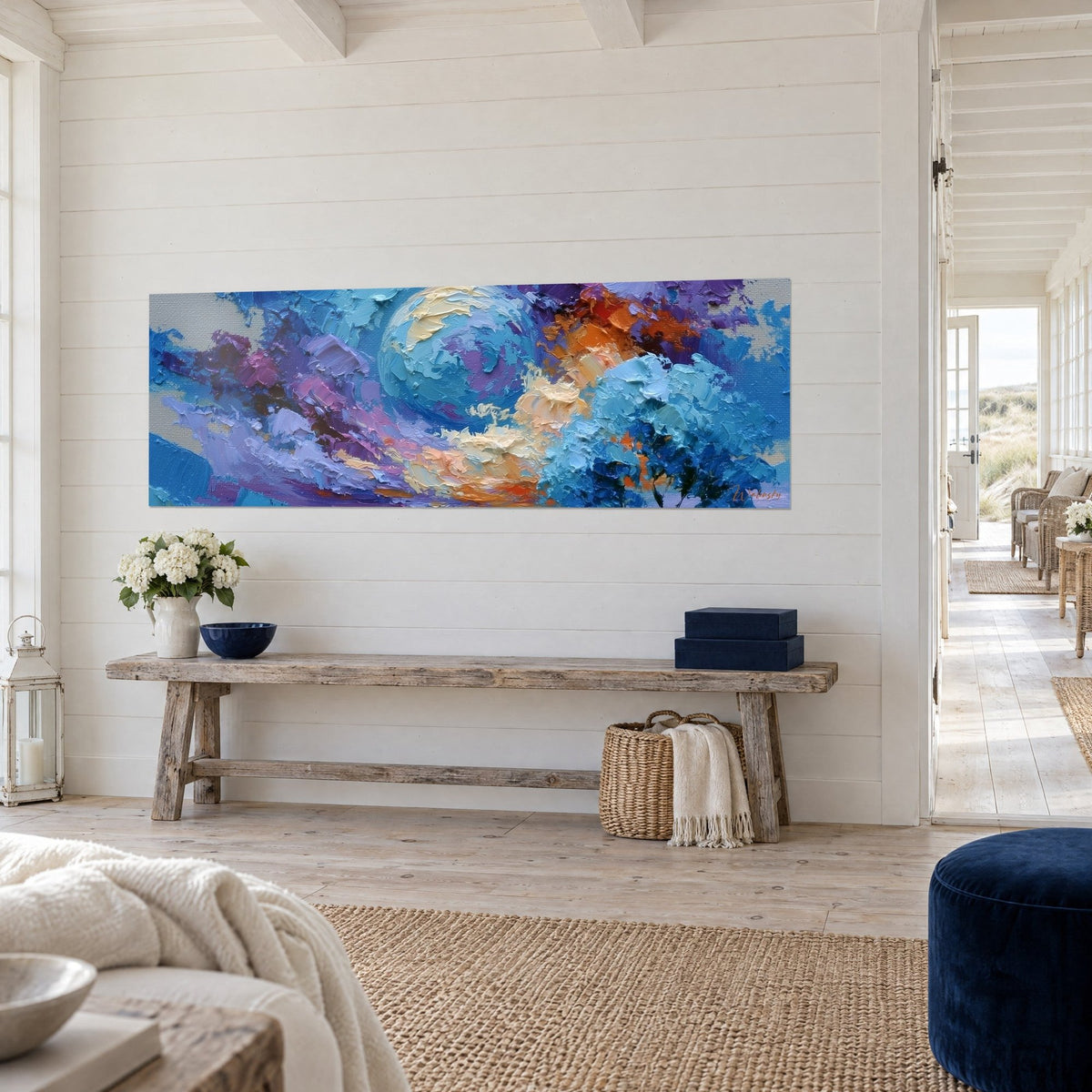 Wall art turquoise moon sphere on indigo and plum sky, dark tree silhouette, three-quarter view on a white slatted wall