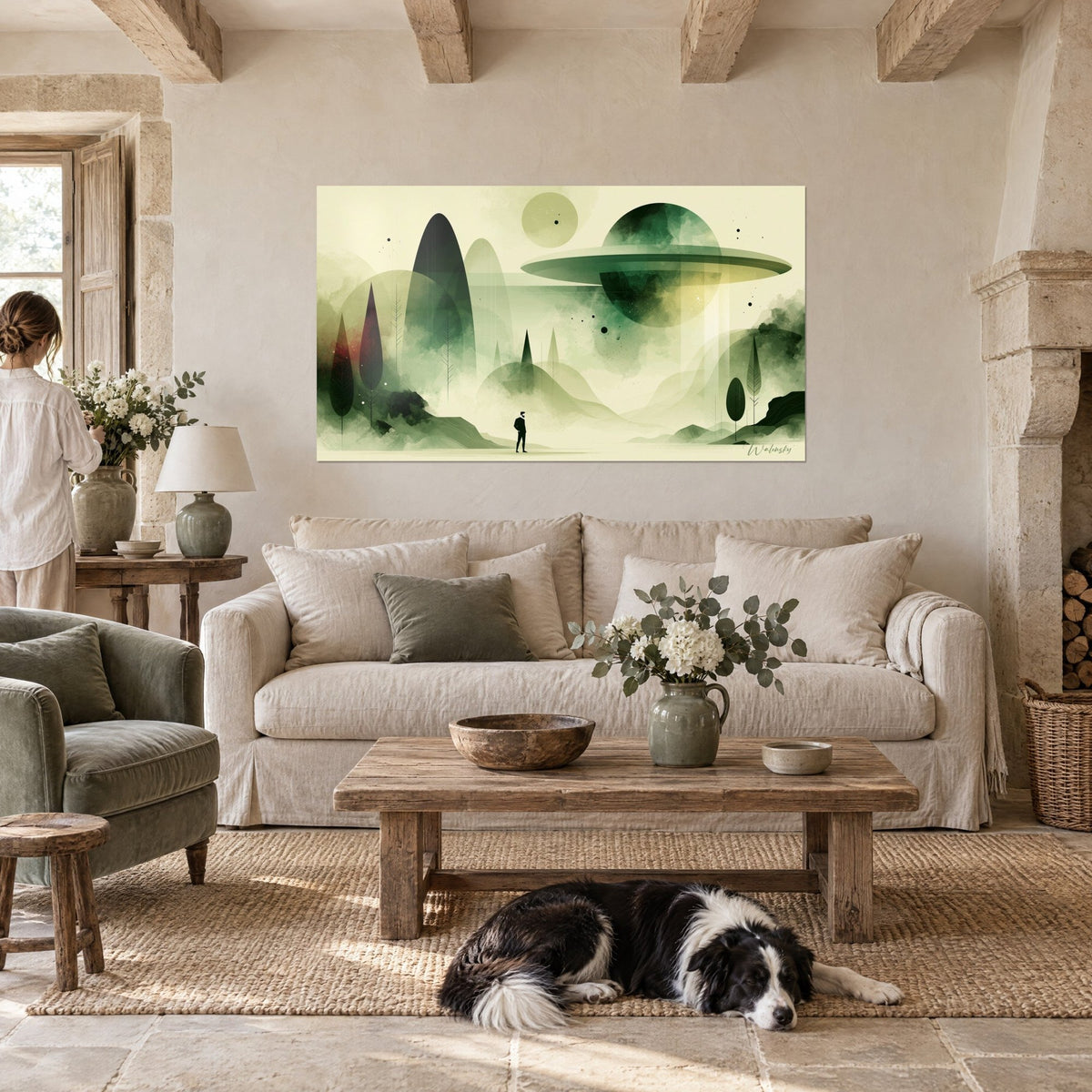 Wall art silhouette of a bearded man facing a sage green celestial disc, cream mists, two figures seen from behind and a collie, above a sofa in a bright living room