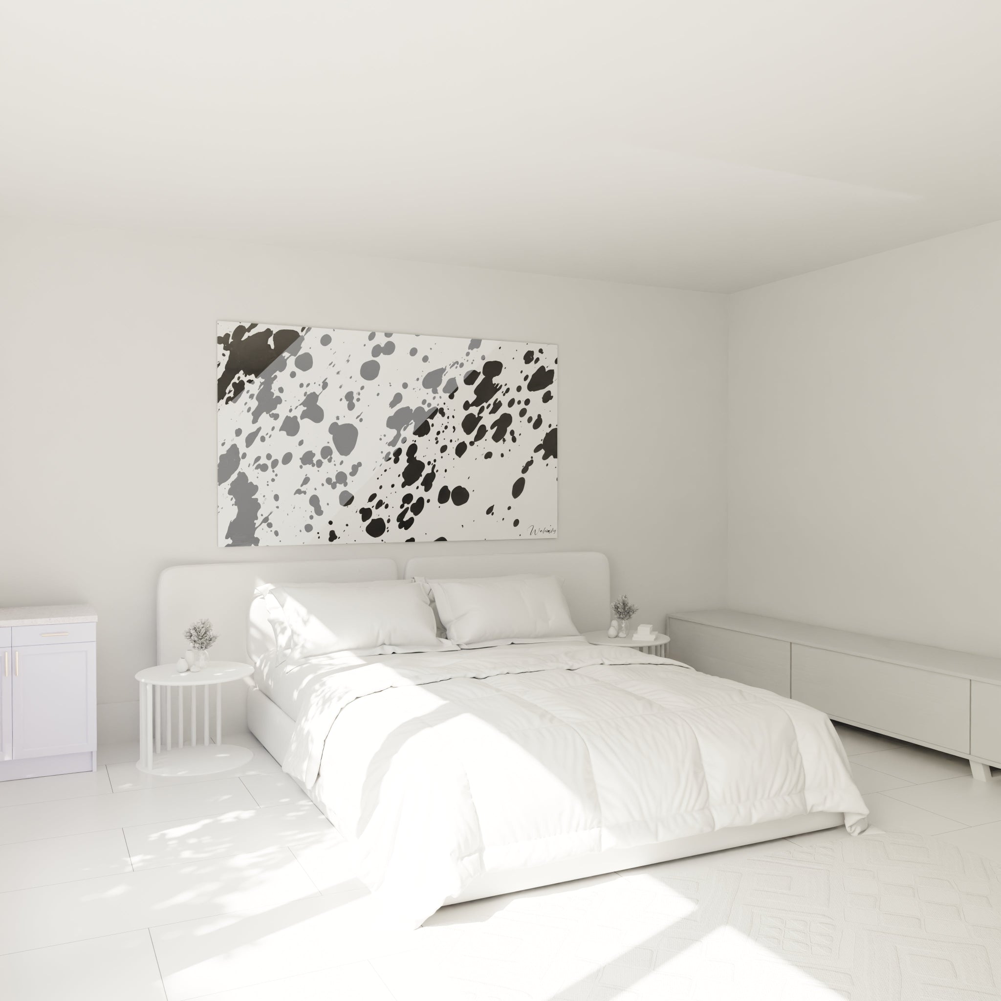 Tableau tacheté noir et blanc Walensky accroché au dessus d'un lit dans une chambre lumineuse