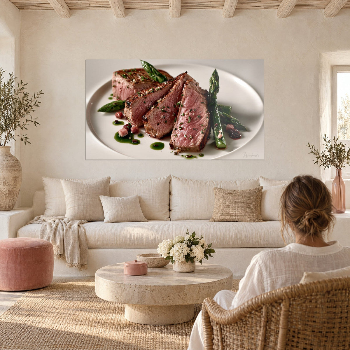 Wall art sliced pink meat, green asparagus and herb coulis on a white plate, above a sofa in a bright living room