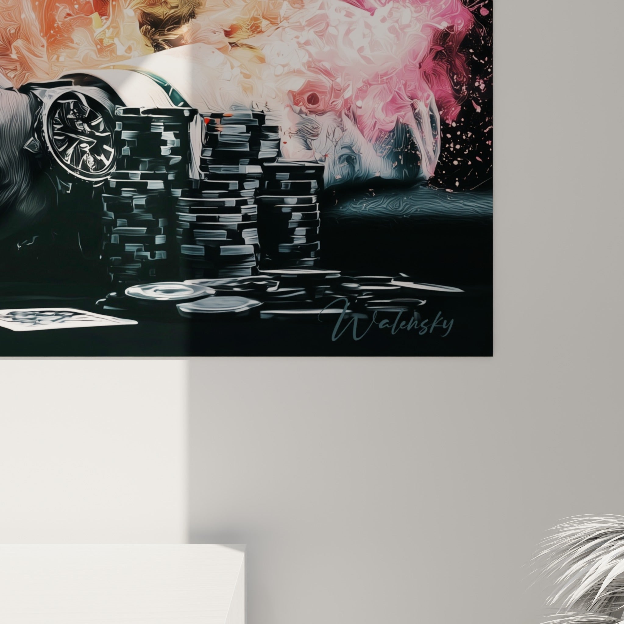 Éclaboussures de peinture turquoise et rose se mêlant en gros plan sur la toile de ce tableau poker accroché