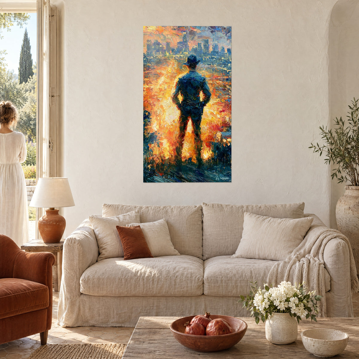 Wall art silhouette of an officer in a Stetson, navy-blue jacket, blazing orange city, two women seen from behind above a sofa in a bright living room