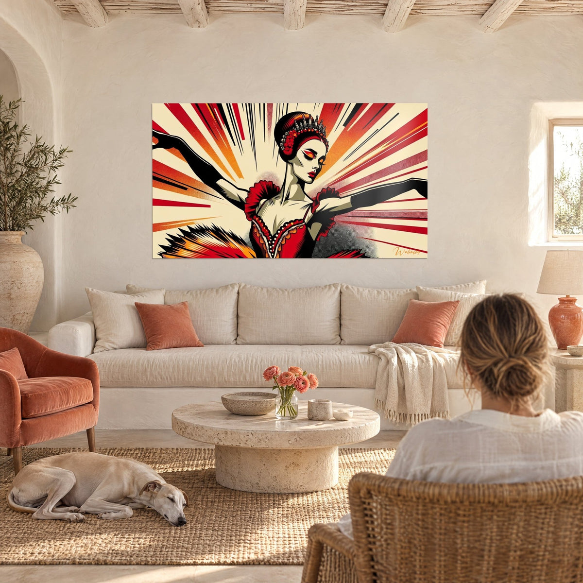 Tableau ballerine en tutu écarlate aux rayons orange et noirs, bras tendus, au-dessus d'un canapé dans un salon lumineux