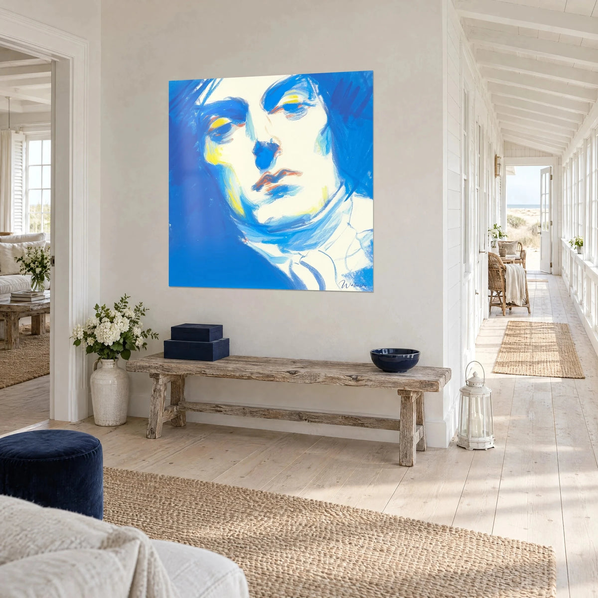 Pastel portrait wall art, downcast gaze, coral red lips on an ultramarine blue background, facing the hallway of a seaside house