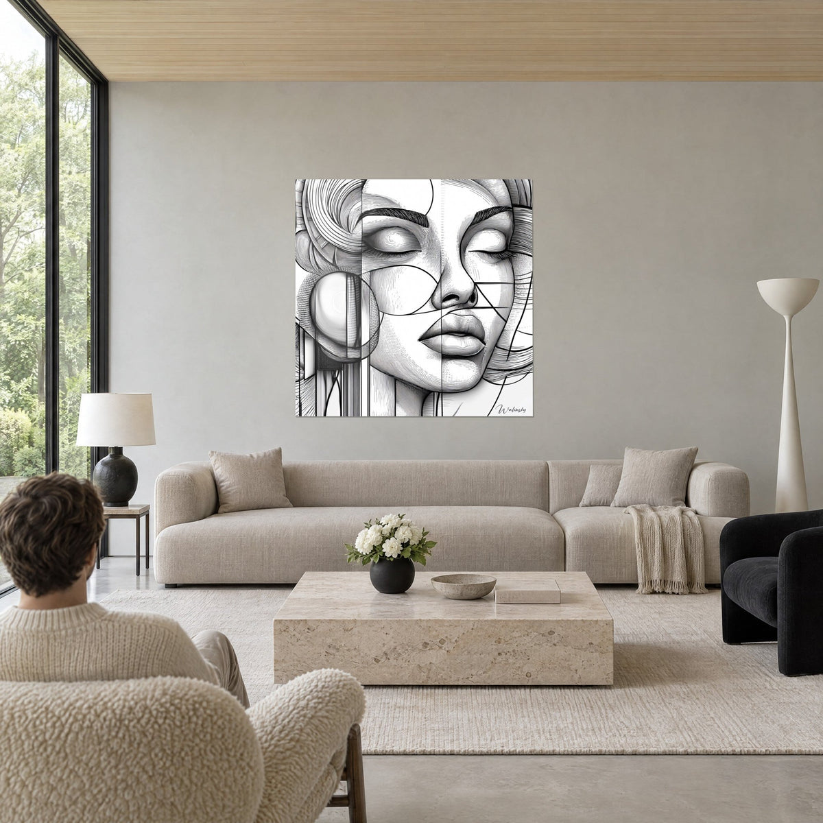 Quadro ritratto femminile dalle palpebre chiuse, tratteggi neri su bianco, cerchi e linee rette, sopra un divano in un soggiorno luminoso