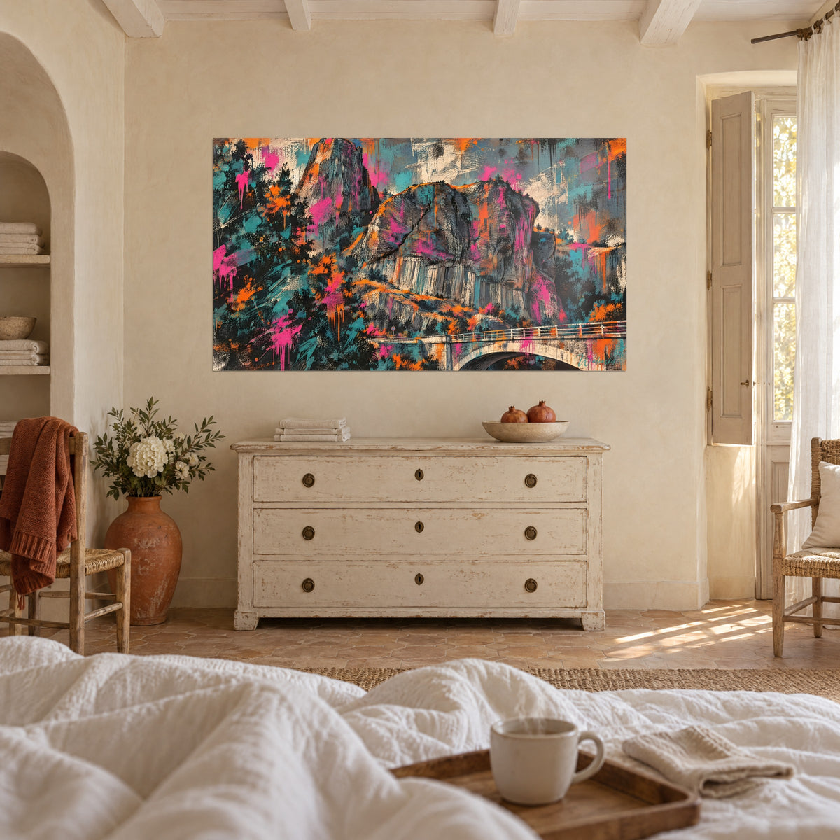 Wall art rocky peak streaked with black lines, pink and orange bursts on a cream sky, above a bed in a light bedroom