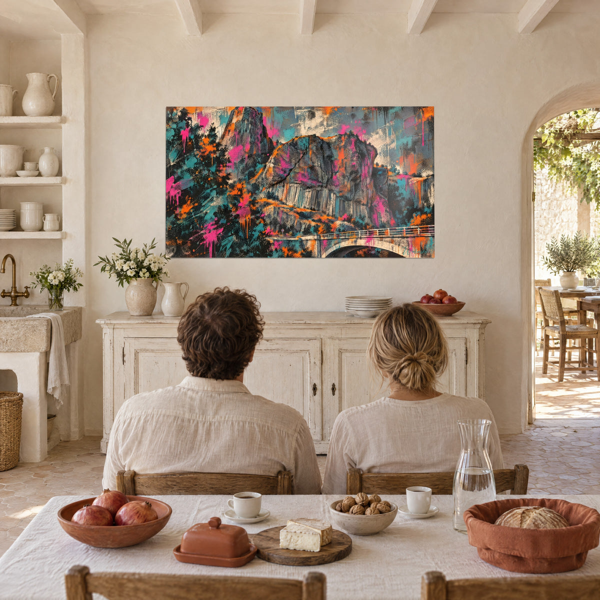 Wall art volcanic mountain with a white bridge, fuchsia and turquoise spots, hung on the wall of a Provençal farmhouse dining room