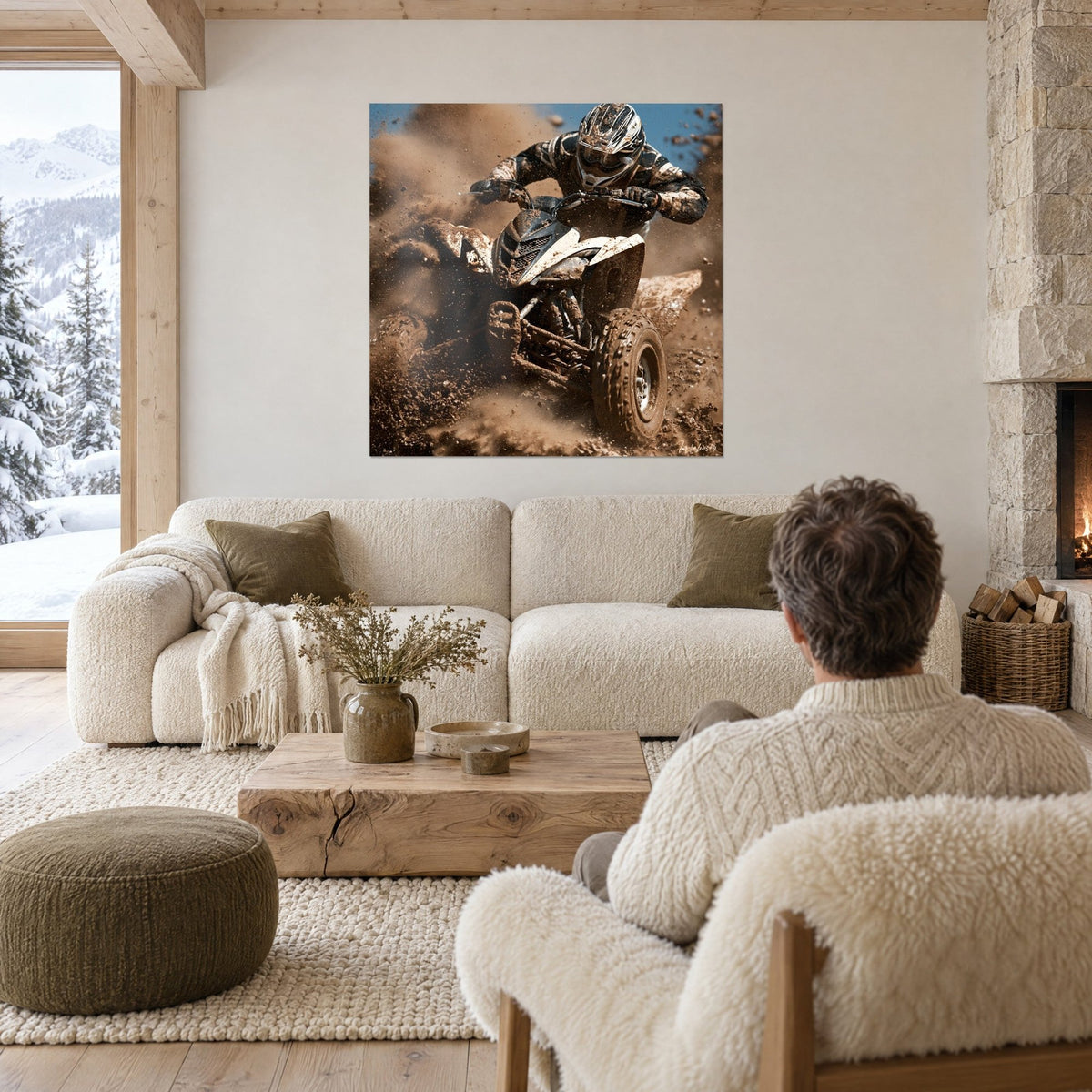 Wall art white quad bike launching through mud, helmeted rider and blue sky, above a sofa in a bright living room