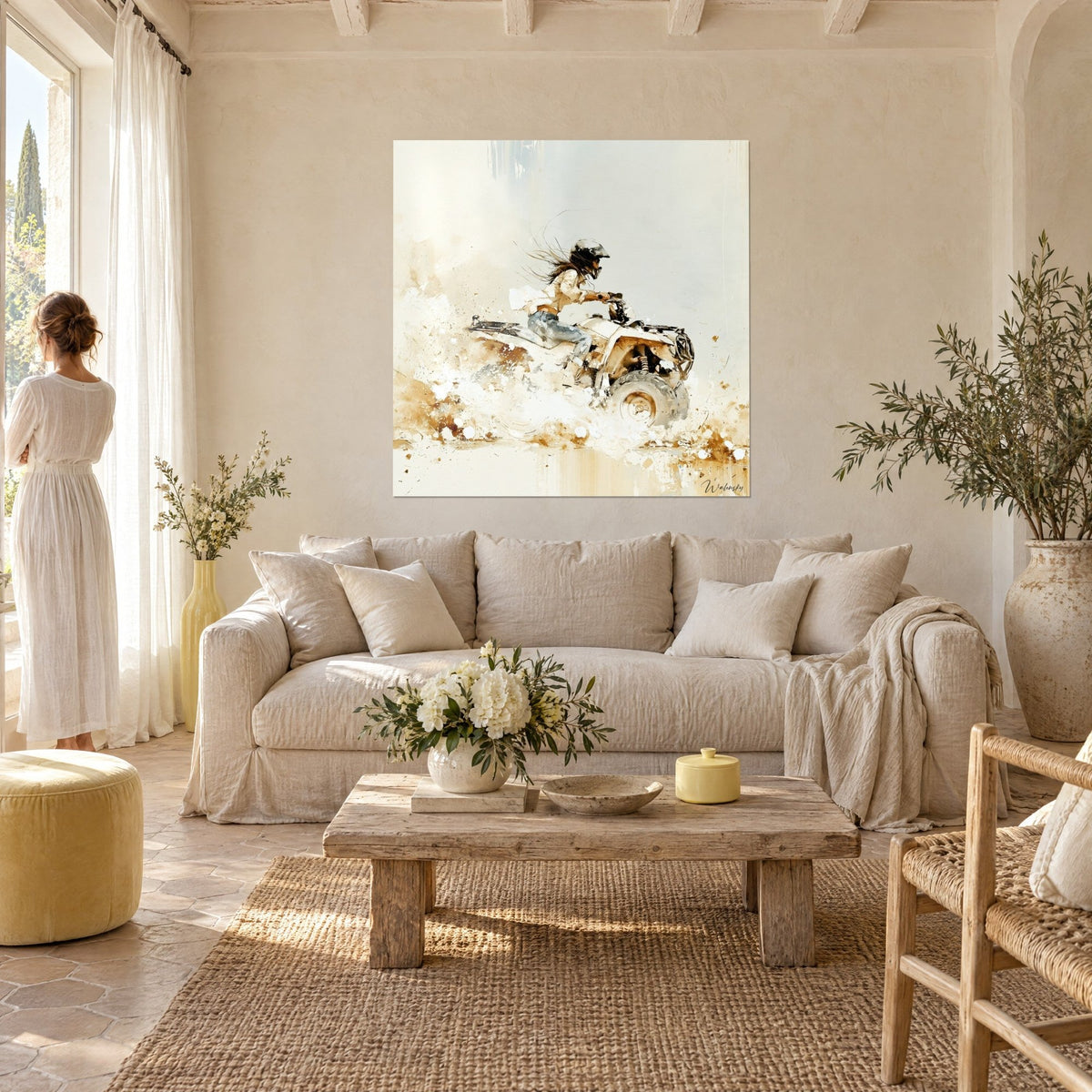 Wall art helmeted pilot on a white quad bike, hair blowing in the wind and ochre dust, two people seen from behind above a sofa in a bright living room