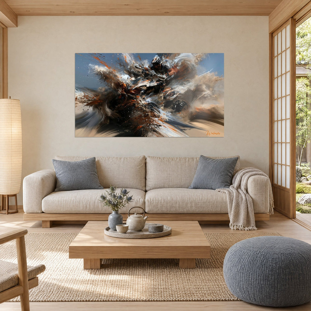 Wall art of a grey and orange quad bike bursting through a fountain of beige sand, hanging above a sofa in a bright living room