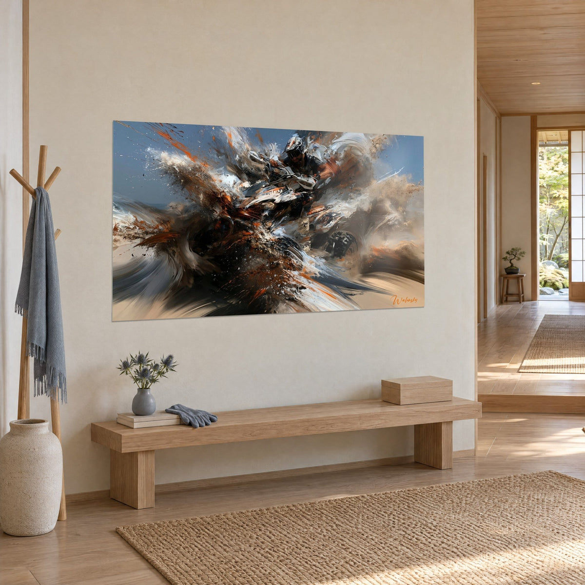 Wall art of a helmeted motocross rider at full speed, brown and white splashes against a blue sky, cream wall in a Japandi hallway