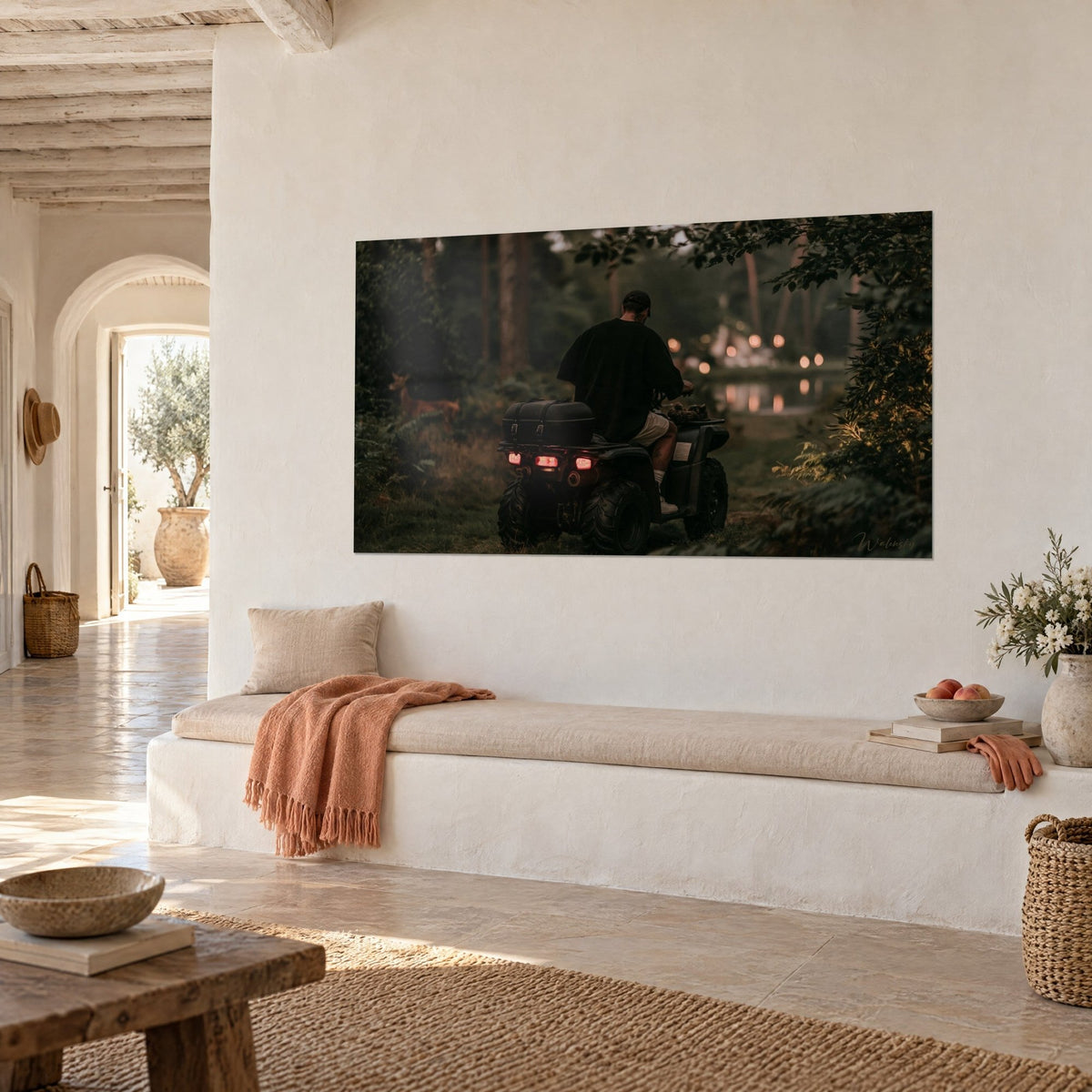 Wall art motorcyclist in black cap on a quad, amber glow of the pond and green ferns, whitewashed wall of a Mediterranean house