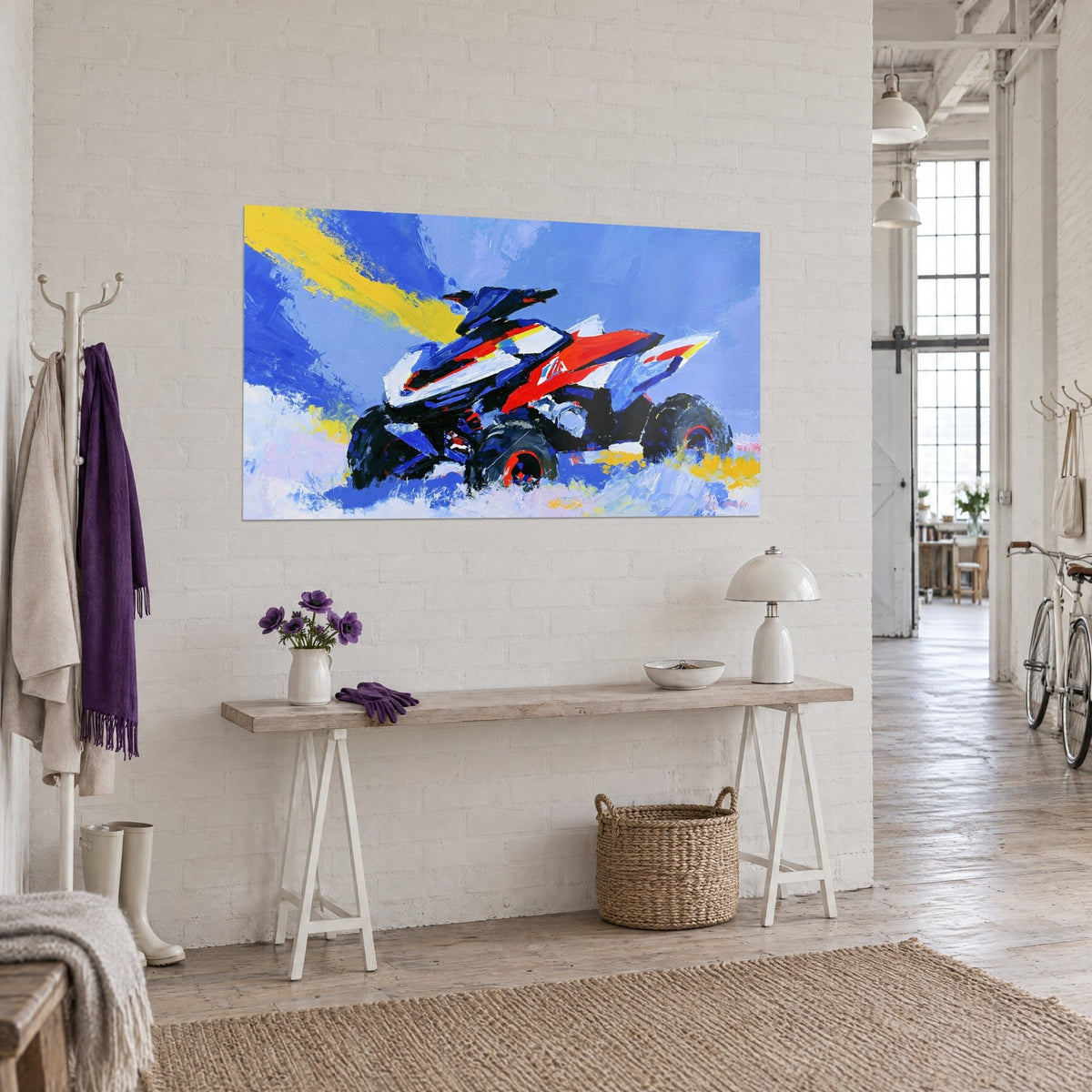 Wall art off-road vehicle with red and white flanks, large black tyres ringed in red, on the white brick wall of a loft
