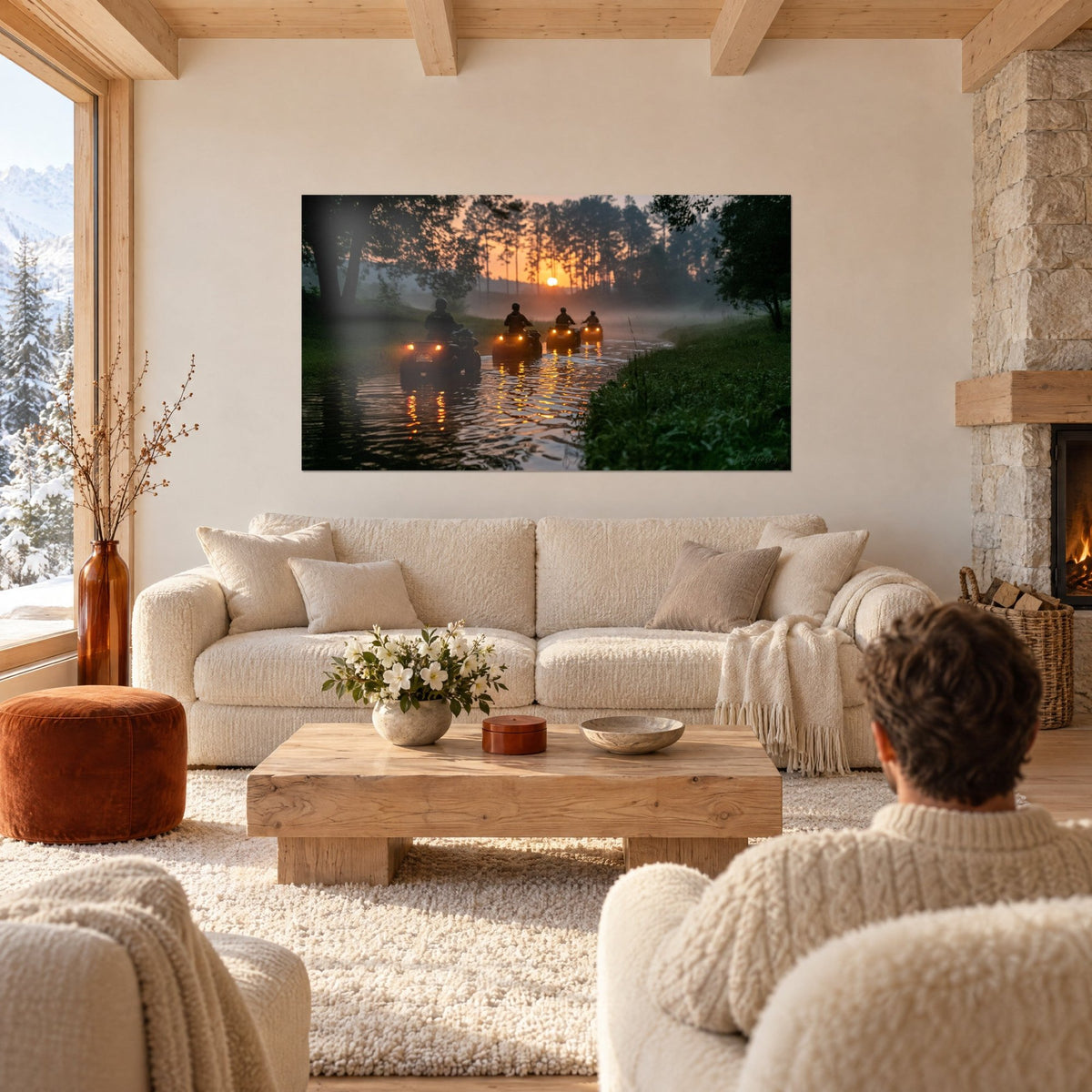 Wall art black quads in a row through a misty ford, orange sun and green pines, above a sofa in a bright living room