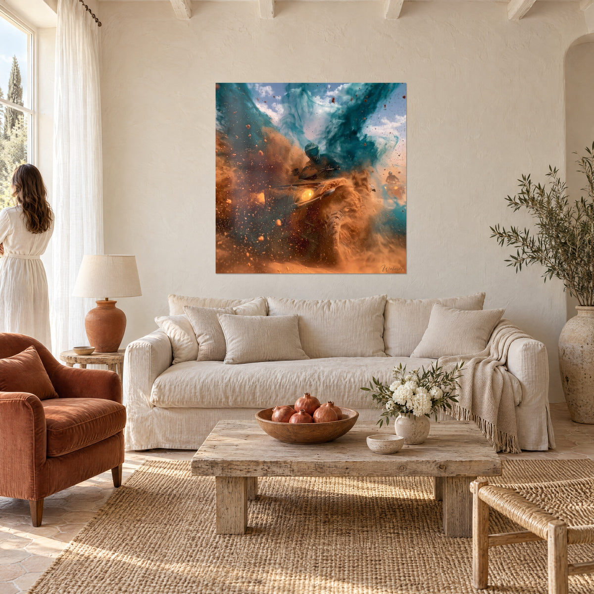 Wall art of a quad bike launching through a cloud of orange sand and turquoise smoke, hung above a sofa in a bright living room