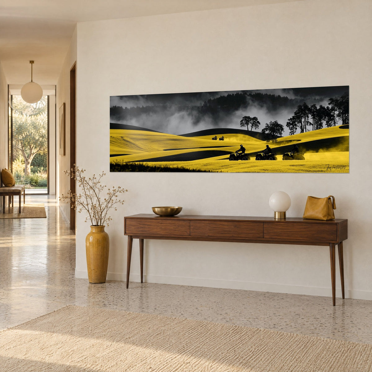 Wall art motorized mountain bike ride across dunes of bright yellow fields and black shadows, forest drowned in mist, three-quarter view in a bright hallway