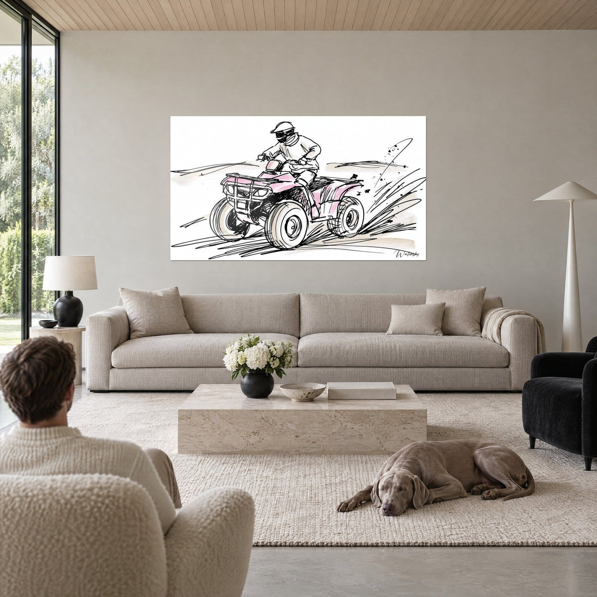 Wall art of a quad bike sliding sideways, pale pink bodywork and black outlines, above a sofa in a bright living room