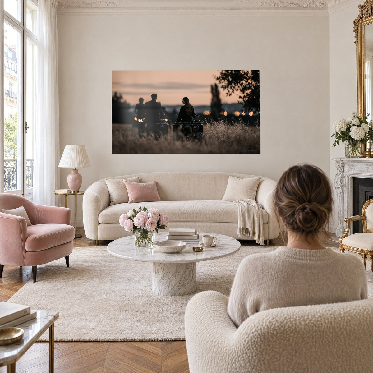 Wall art Two dark quad bikes in golden grass, pink-orange dusk sky, above a sofa in a bright living room