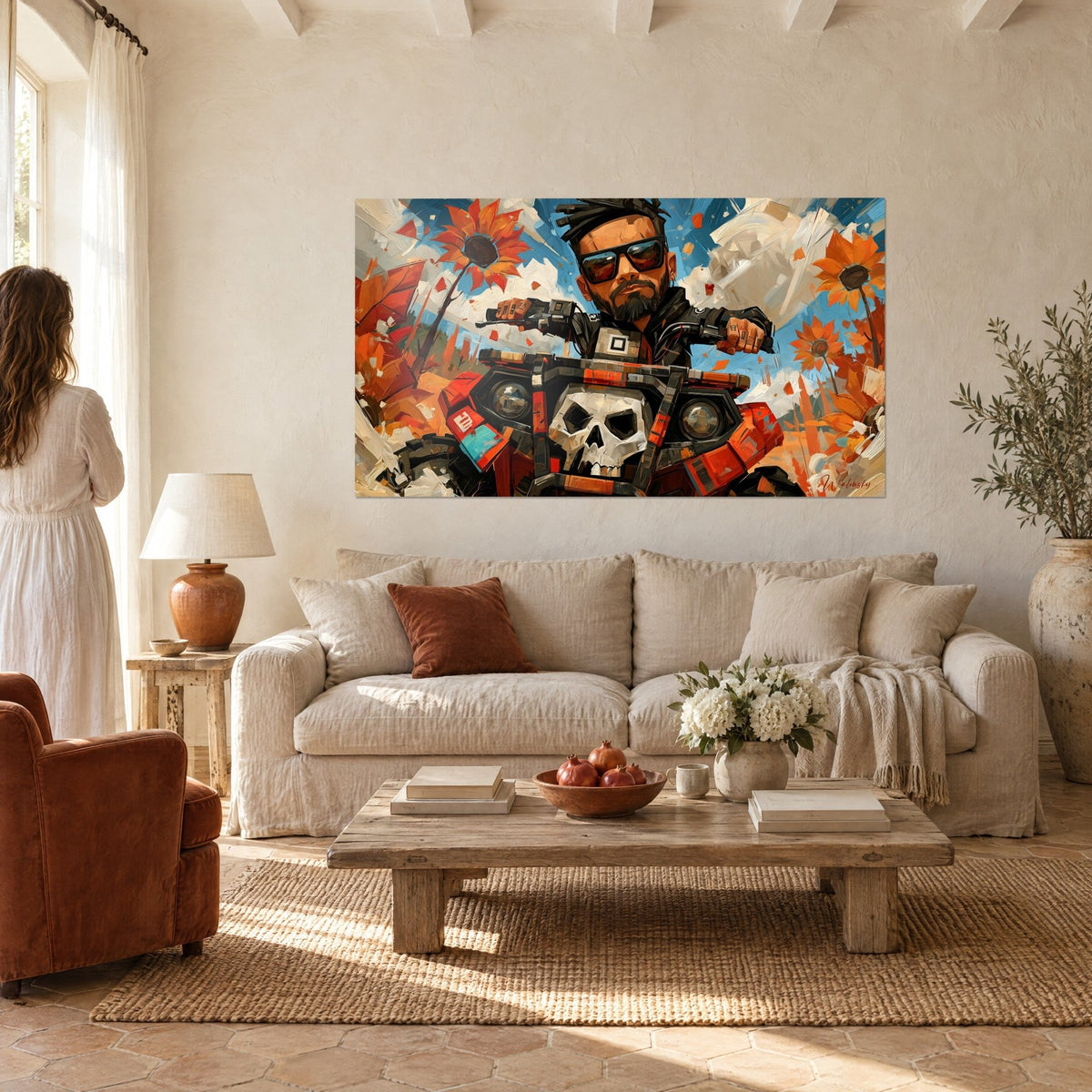 Wall art of a bearded biker in black sunglasses on his quad, white skull and orange sunflowers, above a sofa in a bright living room